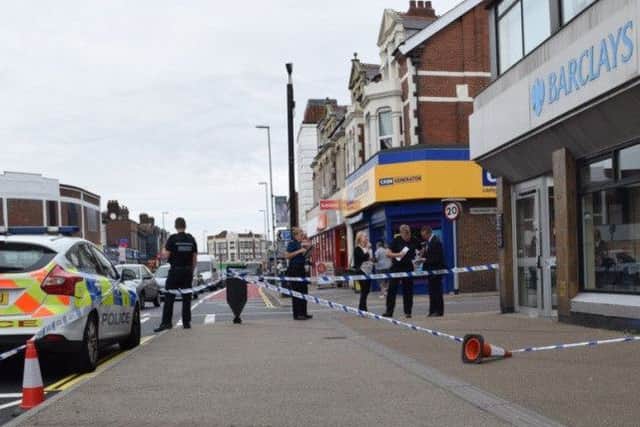 Police outside Barclays Bank in London Road, North End