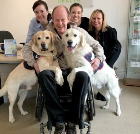 Philippa Oakley, Rhiannon Oakley and Lyn Brand from Acorn Health with Allen Parton and dogs