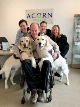 Philippa Oakley, Rhiannon Oakley and Lyn Brand from Acorn Health with Allen Parton and dogs