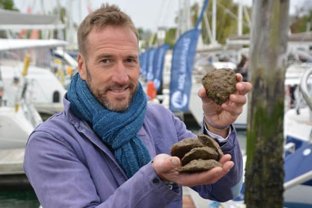 Ben Fogle with oysters to be planted in cages in the Solent