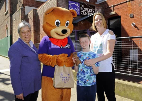 From left, Roberts Centre chief executive Carole Damper, Robert Bear, eight-year-old Matthew Smith and his mum Rachel, 38 

Picture: Malcolm Wells (170418-0947)