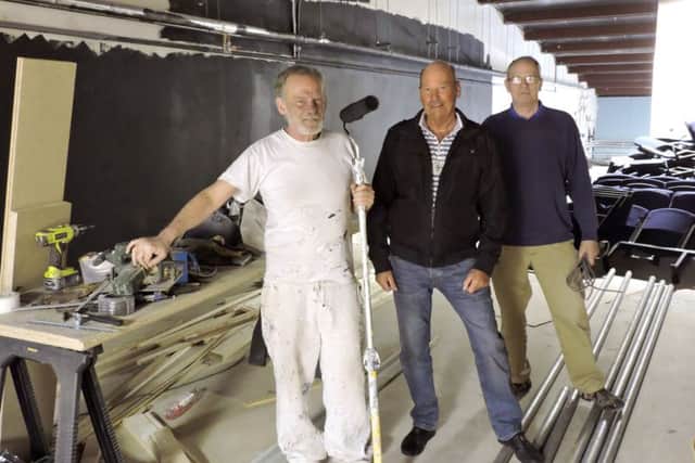 Andrew Bumphrey, Alan James, and Robert
Mcfarland hard at work refurbishing the new studio theatre
