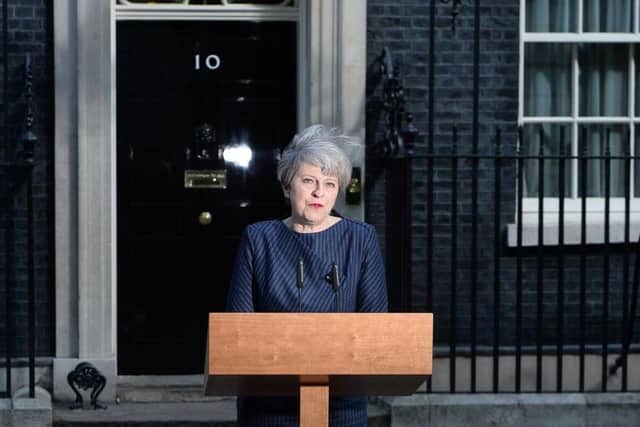 Theresa May making the announcement outside 10 Downing Street.