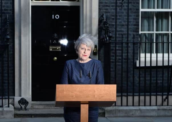 Theresa May making the announcement outside 10 Downing Street.