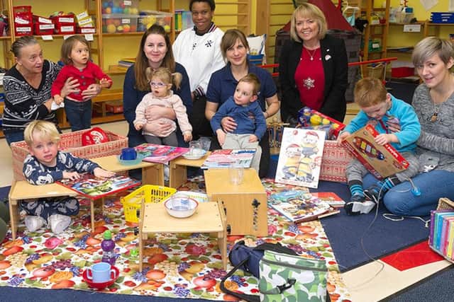 LPT 'Reggie' Crawley delivers Christmas gifts from HMS Collingwood to children at the Rainbow Centre