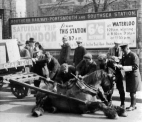 A heartbreaking moment in Commercial Road, Portsmouth, possibly in the 1930s.