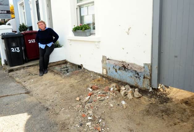 Beverly Cowling, 56, outside her home at Oving Road where the car crashed