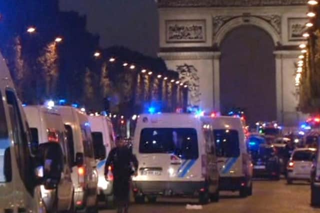In this image made from video, police attend the scene after an incident on the Champs-Elysees in Paris, Thursday April 20, 2017. French media are reporting that two police officers were shot Thursday on the famed shopping boulevard. Picture: AP