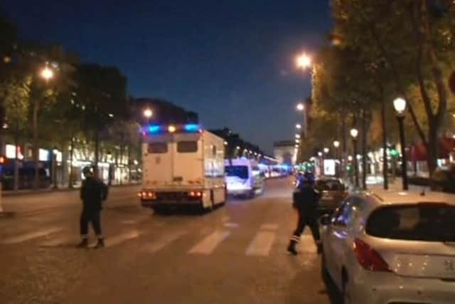 In this image made from video, police attend the scene after an incident on the Champs-Elysees in Paris, Thursday April 20, 2017. French media are reporting that two police officers were shot Thursday on the famed shopping boulevard. Picture: AP