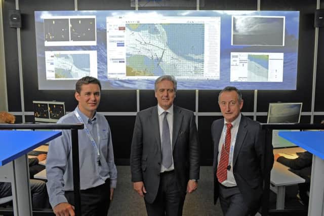 (Left to right)  Richard Daltry, Technical Director of ASV Global, with Mark Garnier MP, Parliamentary Under Secretary of State together with Vince Dobbin, Sales and Marketing Director of ASV Global in the new 'Mission Control' centre at PortchesterPicture:  Malcolm Wells