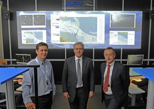 (Left to right)  Richard Daltry, Technical Director of ASV Global, with Mark Garnier MP, Parliamentary Under Secretary of State together with Vince Dobbin, Sales and Marketing Director of ASV Global in the new 'Mission Control' centre at Portchester

Picture:  Malcolm Wells