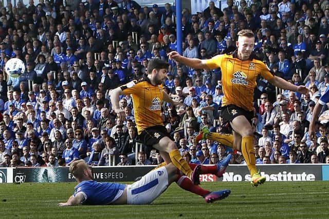 Jack Whatmough makes a last-ditch tackle for Pompey against Cambridge United Picture: Barry Zee