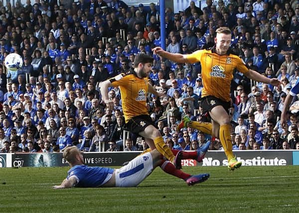Jack Whatmough makes a last-ditch tackle for Pompey against Cambridge United Picture: Barry Zee