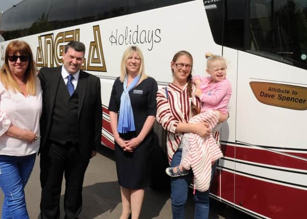 Pictured is: (middle) Robert Pressley, managing director of Angela Coaches and Paula Roe, managing director of Angela Holidays, with David Spencer's daughters (left) Elizabeth Pritchard (46), (right) Vicky Spencer (36) and her daughter Adriana Daborn (3).  Picture: Sarah Standing (170508-219)