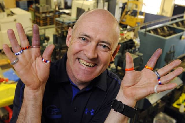 Stephen Wilde,general manager of Southbourne Rubber  in Waterlooville,with MiBands Picture: Malcolm Wells (170403-9230)