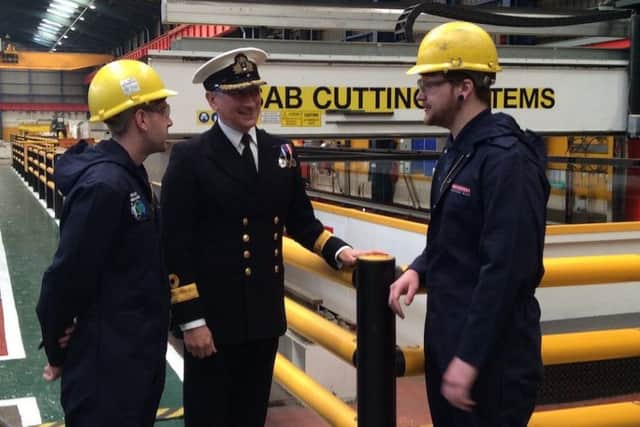Commodore Peter Coulson talking to workers at Govan shipyard, where the first sheet of steel was cut for HMS Spey