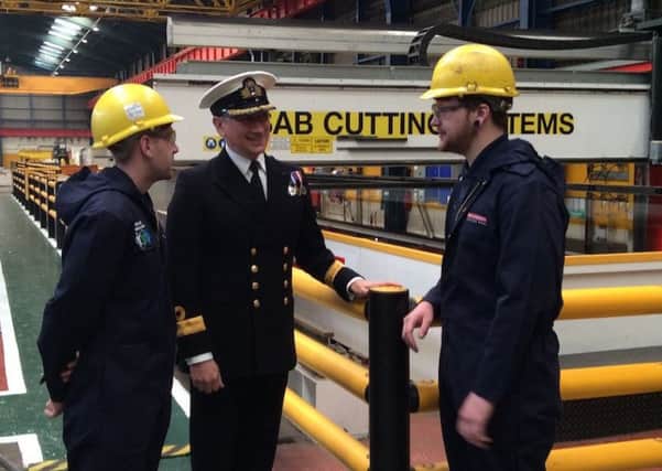 Commodore Peter Coulson talking to workers at Govan shipyard, where the first sheet of steel was cut for HMS Spey