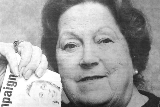 Conservative candidate Audrey Ellis tears up a Liberal Democrat election leaflet