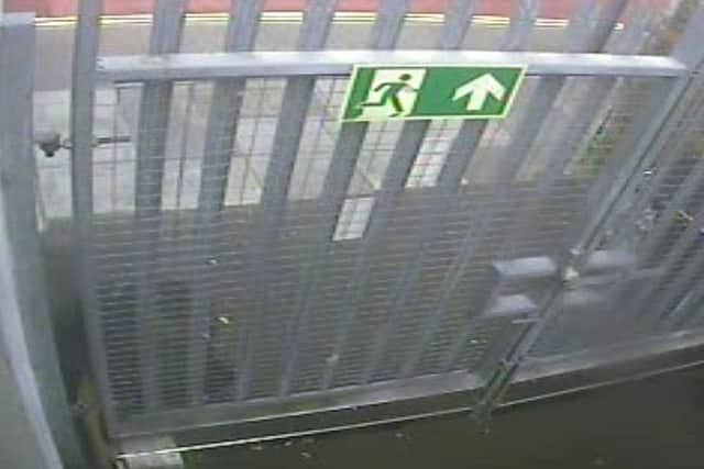 Dler Mohammed leaves the knife in a white drinks carton by the delivery gates for Sainsbury's in London Road, North End, Portsmouth on the morning of the day he attacked a woman in the street