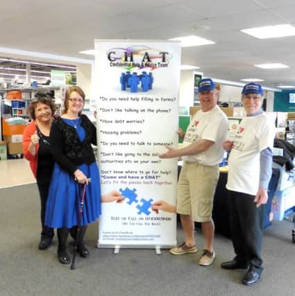 Gosportarians Malcolm Dent and Simon Mason, right, with Maria Fuccio and Jeanette Mae Perry from the advice organisation, CHAT, with the sign donated by Gosportarians