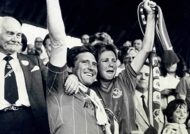 Alan Ball with son Jimmy after Pompey won promotion to the First Division at the end of the 1986-87 season