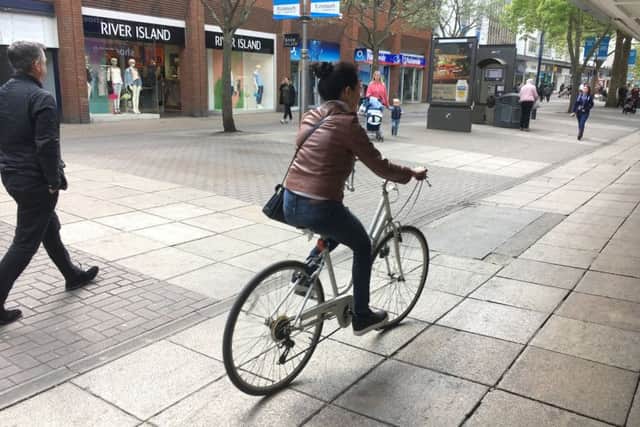 A woman on a bike in Commercial Road