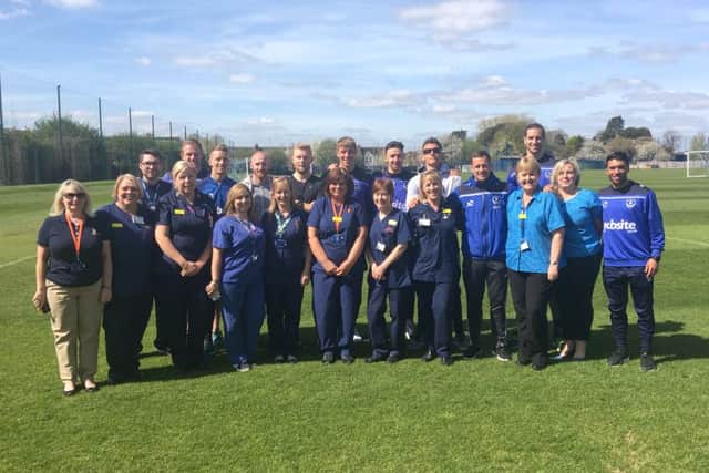 Pompey Football Club Teams Up with QAH Specialist Screening Practitioners 
QA Bowel Cancer Team: Front row, from left to right: Julia Biles, Sally Barrett,  Joe Mitchell, Carly Howes, Tracie Jarvis, Debbie Butler, Jane Rulf, Rose Duane-Moore, Debra Chivers, Claire Clapp
