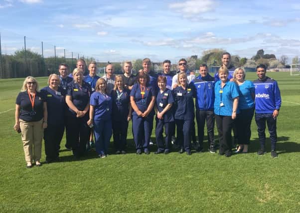 Pompey Football Club Teams Up with QAH Specialist Screening Practitioners 
QA Bowel Cancer Team: Front row, from left to right: Julia Biles, Sally Barrett,  Joe Mitchell, Carly Howes, Tracie Jarvis, Debbie Butler, Jane Rulf, Rose Duane-Moore, Debra Chivers, Claire Clapp