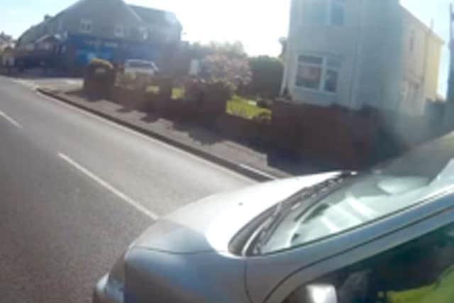 Another still captured by a cyclist's helmet camera
