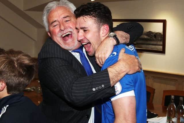 Enda Stevens celebrates promotion with Pompey chairman Iain McInnes. Picture: Joe Pepler