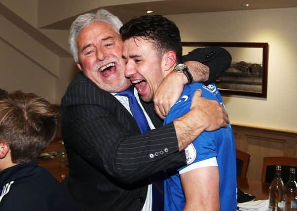 Enda Stevens celebrates promotion with Pompey chairman Iain McInnes. Picture: Joe Pepler