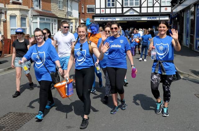 Blue Day fundraising walkers leave Fratton Park last year, heading for Gunwharf Quays