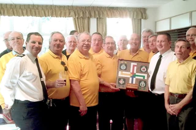Gosport Mens Shed Shedders presenting HMS Sultan staff with a hand-made uckers board