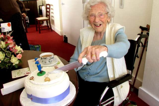 Elsie Pickles cutting her 104th birthday cake
