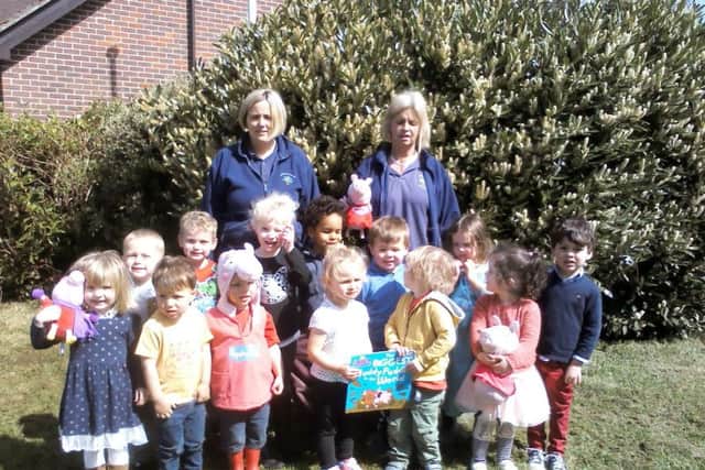 Supervisor Emily Moore, left, and deputy supervisor Becky Lansley, back right, with children from Hambledon Pre-School getting ready for their Muddy Puddle Walk for Save the Children