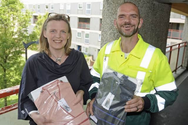 Claire Robinson, from Inga Wellbeing, with Paul Green who found stolen clothes destined for cancer patients that had been dumped near Gunwharf Quays