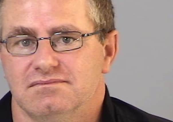 Gary Trower was jailed at Portsmouth Crown Court for two years after sending an 'onslaught of sadistic' sexual messages threatening to rape a woman and a girl