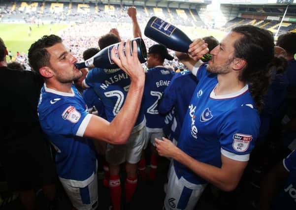 Gareth Evans celebrates Pompey's promotion with Christian Burgess. Picture: Joe Pepler