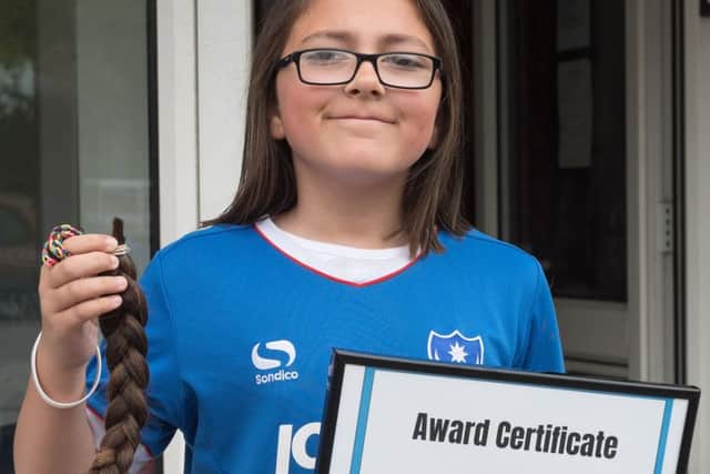 Isabelle Phillips had her haircut for the Little Princess charity Picture: Keith Woodland