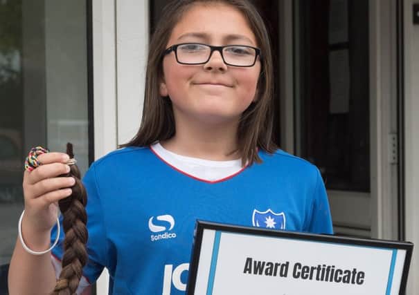 Isabelle Phillips had her haircut for the Little Princess charity Picture: Keith Woodland