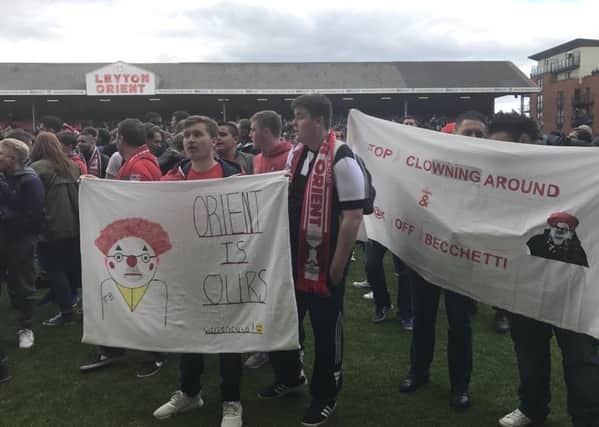 Fans invade the pitch at Brisbane Road during Leyton Orient's game with Colchester