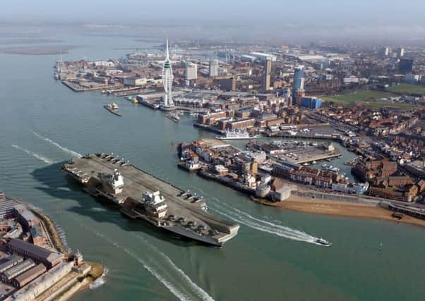 A computer-generated image of HMS Queen Elizabeth leaving Portsmouth Harbour. Picture: MoD