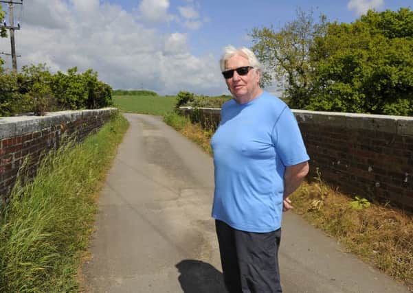 John Suttie, 74, on the track that backs onto his property and leads to the proposed area of development at Downend
Picture: Malcolm Wells (170502-2271)