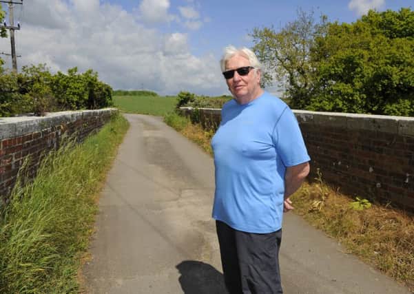 John Suttie, 74, on the track that backs onto his property and leads to the proposed area of development at Downend

Picture: Malcolm Wells (170502-2271)