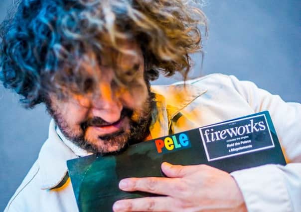 Ian Prowse, clutching a copy of his old band Peles debut album, Fireworks. Picture by John Johnson