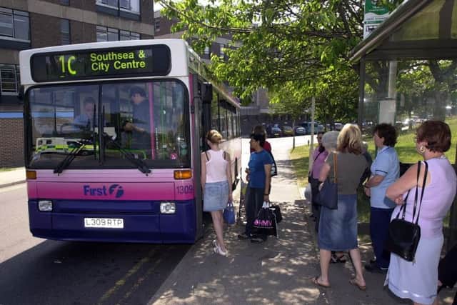 A bus pulls up at QA Hospital