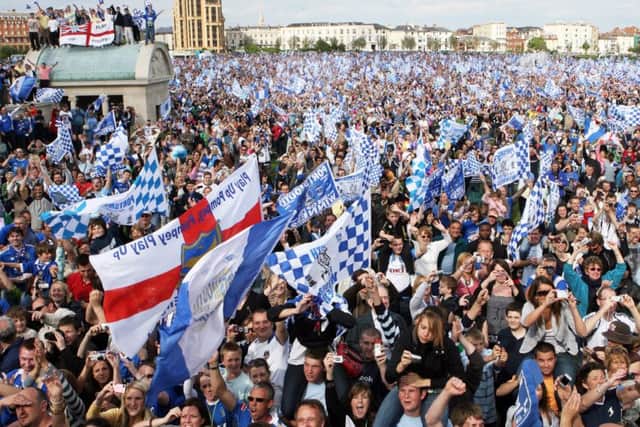 Fans celebrate at Pompey's open-top bus parade after they won the FA Cup in 2008