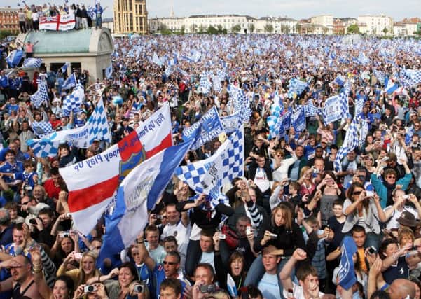 Fans celebrate at Pompey's open-top bus parade after they won the FA Cup in 2008