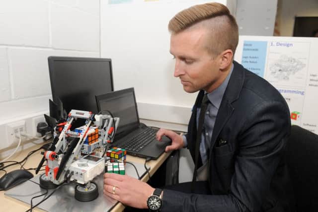 Daniel Gulanowski, 35, with his Lego Rubik's Cube robot.Picture: Sarah Standing (170578-6860)