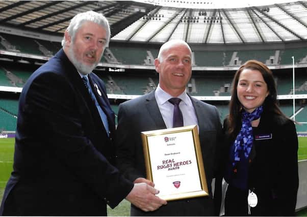 From left, England Rugby Football Schools Union president Geoff Simpson, Dean Dryhurst, and Donna Edmonds from NatWest bank